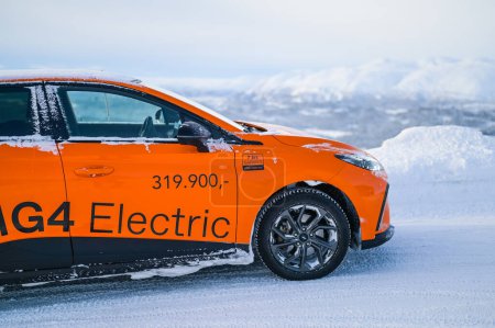 Photo for Rauland, Norway - January 14, 2023: Orange electric car MG4 is a hatchback chinese electric car - Royalty Free Image
