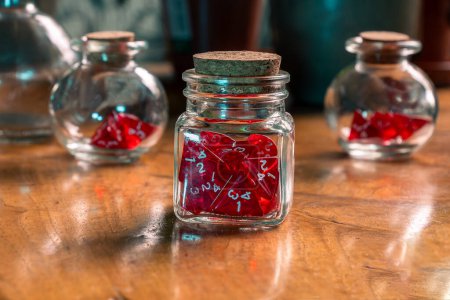 Red dice in glass jars on a vintage wooden table, blending gaming charm with rustic elegance
