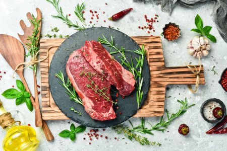 Photo for Meat. Aged striploin steak. On a gray concrete background. Free space for text. - Royalty Free Image