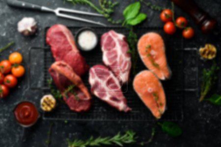 Defocused food background. Foods with a high protein content: meat, fish, chicken eggs. Top view. Free space for your text.