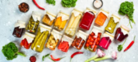 Photo for Defocused food background. Set of pickled food stocks in cans. Top view. Free space for your text. - Royalty Free Image