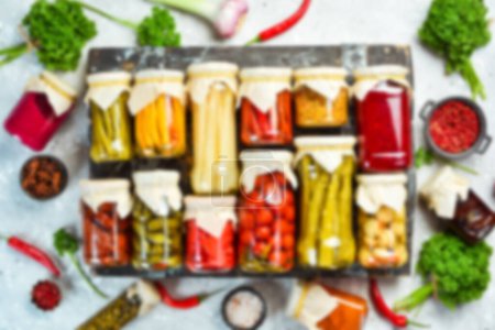 Photo for Defocused food background. Set of pickled food stocks in cans. Top view. Free space for your text. - Royalty Free Image