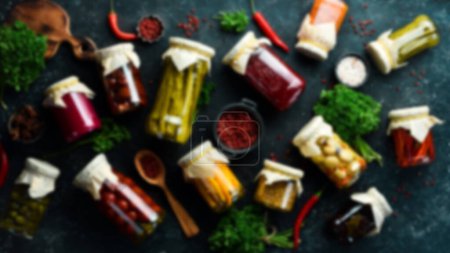 Photo for Food stocks. Defocused food background. A set of pickled food supplies in cans in case of war. Top view. Free space for your text. - Royalty Free Image