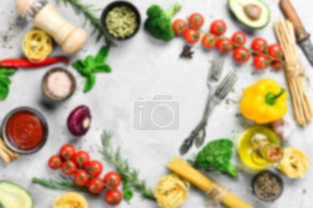 Photo for Defocused food background. Gray stone cooking background. Spices and vegetables. Top view. Free space for your text. - Royalty Free Image