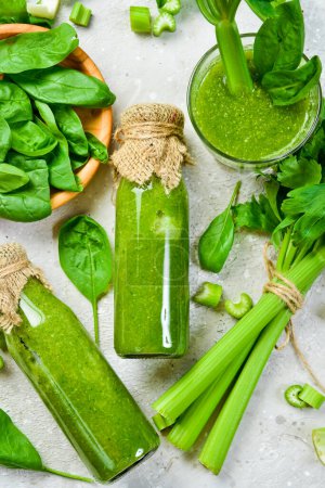 Photo for Vegetarian detox diet green smoothies with fresh celery, spinach. Healthy food. Free space for text. - Royalty Free Image