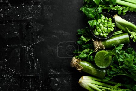 Photo for Celery juice in glass bottles and a stalk of fresh celery. Dietary healthy food. Free space for text. - Royalty Free Image
