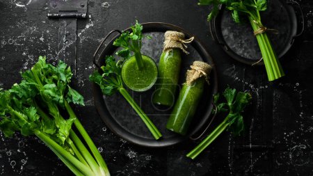 Photo for Celery juice in glass bottles and a stalk of fresh celery. Dietary healthy food. Free space for text. - Royalty Free Image