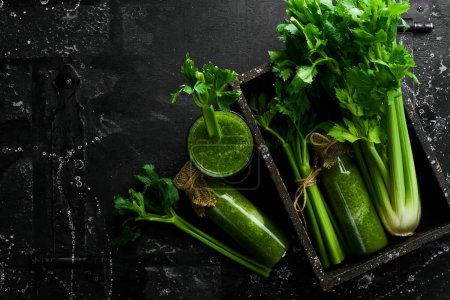 Photo for Celery. Celery smoothies in glass bottles. Detox menu. Free space for text. - Royalty Free Image
