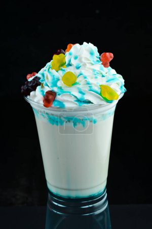 Photo for Milkshake in a paper cup. on a black background. Free space for text. - Royalty Free Image