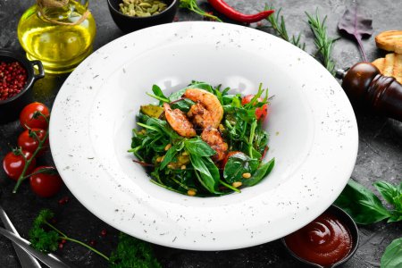 Photo for Salad with shrimp and arugula on a plate, restaurant serving. Top view. Free space for text. - Royalty Free Image