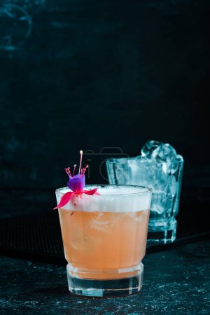 Photo for Pink alcoholic cocktail. On a black background. - Royalty Free Image