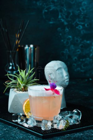 Photo for Pink alcoholic cocktail. On a black background. - Royalty Free Image