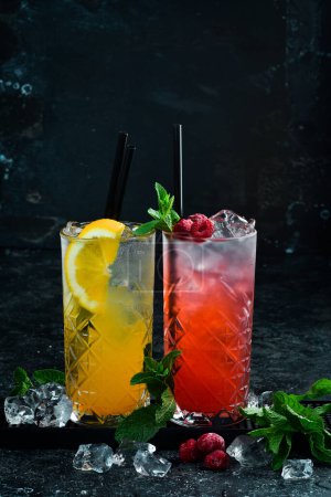 Photo for Set of colored cocktails. A set of lemonades. Bar counter with drinks. Banner. On a black background. - Royalty Free Image