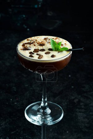 Photo for Summer cocktail and bar concept. Fresh alcoholic cocktail with coffee liqueur and coffee beans and ice. Bar menu. - Royalty Free Image
