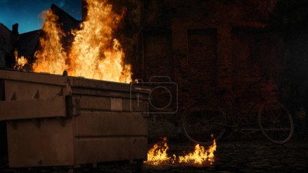 Photo for Dumpster Fire Alley Wall Background features a dumpster with fire billowing out in an alley with a brick wall behind and falling ash. - Royalty Free Image