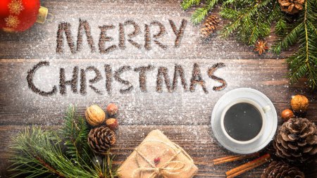 Photo for Merry Christmas Desk Message features a desktop with Christmas items around the edges and the words Merry Christmas written in white powder on the desktop, Not A.I. generated. - Royalty Free Image