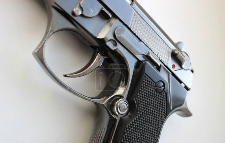 Photo for Trigger And Trigger Guard Of Pistol Gun On White Surface Detailed Stock Photo - Royalty Free Image