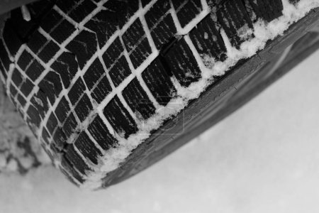 Photo for Closeup Photo Of Packed With Snow Contact Patch Of Non Studded Car Tire - Royalty Free Image