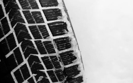 Photo for Winter Studless Car Tire In A Deep Untouched Snow Top View Closeup Stock Photo - Royalty Free Image