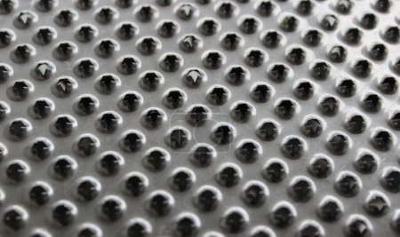 Jagged Edges Of Holes On Steel Puree Grater Surface Textured Background 