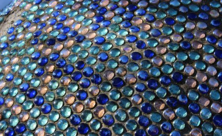 Pattern Of Penny Round Mosaic Glass In Concrete Basement  