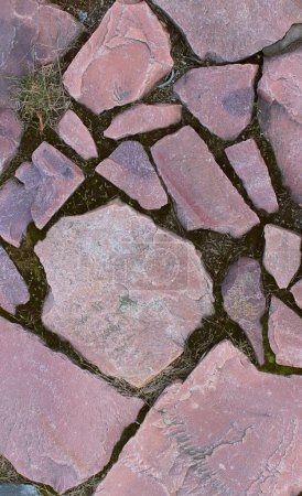 Detailed pattern of red stones in ancient basement stock photo for vertical backgrounds