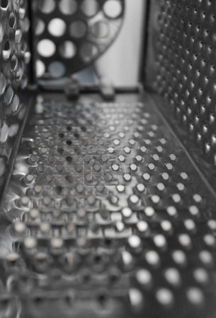 Closeup view of inner part of a square kitchen grater
