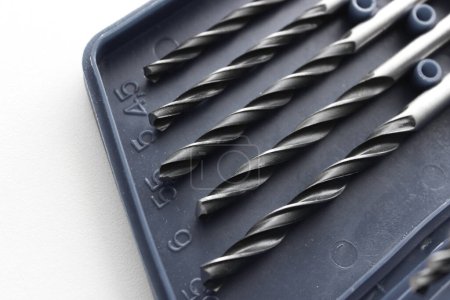 Five variety diameter metal drills in plastic box with indicating the drill diameter in millimeters