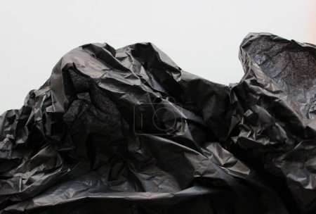 Pattern Of Black Crumpled Packaging Material Vertical Stock Photo 