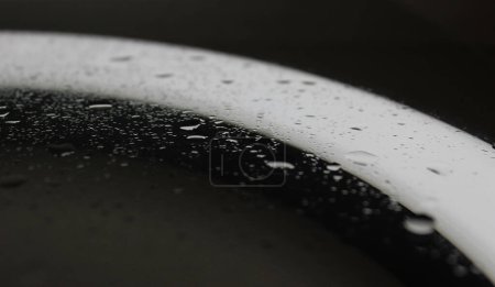 Sprinkled Water Drops On Clean Illuminated Glass After Repellent Coating Macro Shot Stock Photo 