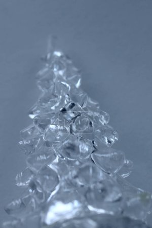 Pointed icicle with jagged edges on a clean background stock photo for vertical story 