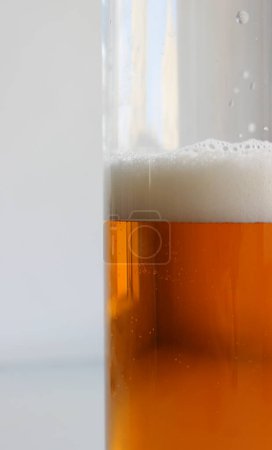 Side Of Massive Beer Mug With Classic Light Beer With Foam Bubbles Vertical Stock Photo For Beer Backgrounds 