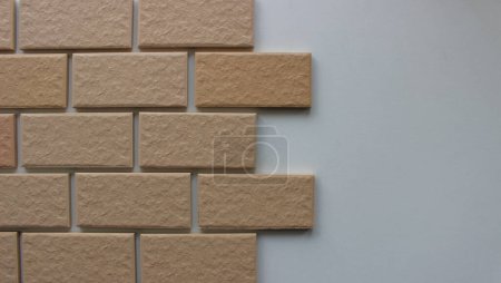 The process of laying facing tiles with a brickwork pattern stock photo for house renovation backgrounds