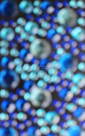 Blurred Pattern Of Round Rhinestones Shining With Variety Shades Of Blue. Defocused Stock Photo For Vertical Story 