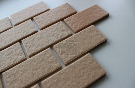 Wall tiles imitating the brickwork on a white surface angle view stock photo