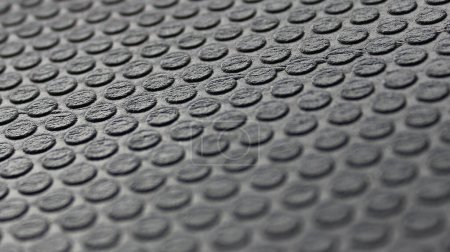 Muster aus extrudierten Rundteilen auf gummiertem Schutzmaterial. Gummioberfläche Hintergrund Archivbild