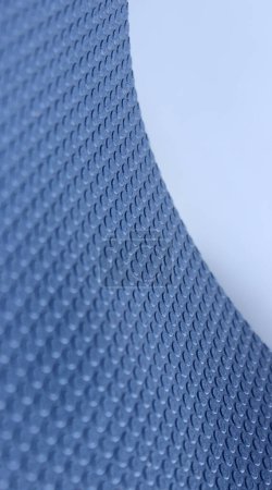 Curved Edge Of Sheet Of Elastic Material With 3D Extruded Circles On It. Stock Photo For Abstract Blue Backgrounds