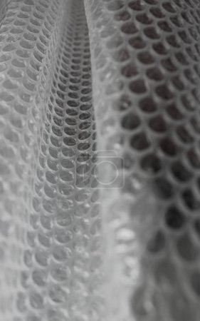 Pliegues de película de burbuja compostable transparente Foto de stock vertical para fondos 
