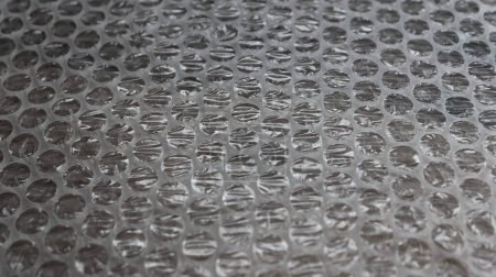 Used Bubble Wrap Sheet Angle View Textured Stock Photo. Package Material Backgrounds