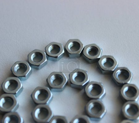 Part Of Circle Pattern Arranged With Hex Nuts Isolated On White Square Stock Photo