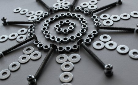 Shiny Steel Nuts, Washers And Variety Bolts Arranged With Symbolic Star Shape