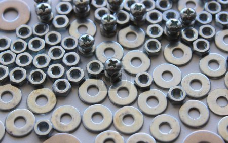 Flat Surface Of Scattered Metal Color Bolts, Nuts And Washers Closeup View. Stock Photo For Metalware Backgrounds