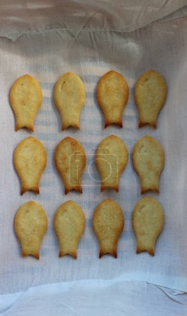 Freshly Baked Salt Fish Crackers In Lines Inside Bread Basket Vertical Stock Photo