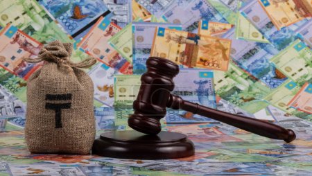 Judge's gavel and Kazakh currency - tenge