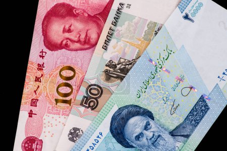 Photo for Fragments of Chinese, Russian and Iranian banknotes - Royalty Free Image