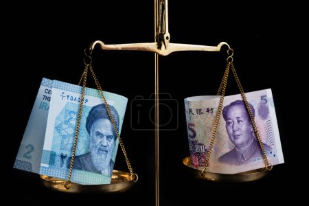 Photo for Iranian and Chinese banknotes on different scales - Royalty Free Image