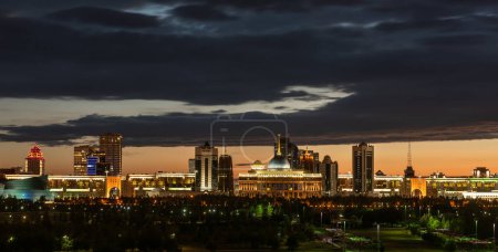 Photo for The central part of the capital of Kazakhstan, the city of Astana, and the residence of the President under the disturbing sky at evening twilight - Royalty Free Image