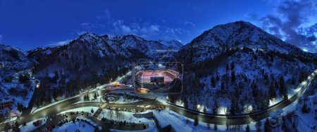 Photo for Almaty, Kazakhstan. 02.13.2024.The famous Medeu ice stadium with the inscription "Medeu ice stadium" in Russian and Kazakh on a winter evening - Royalty Free Image
