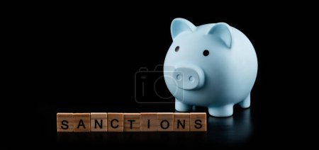 Blue piggy bank and the words "sanctions"