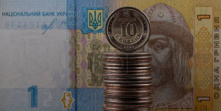 10 Ukrainian hryvnia coin and 1 Ukrainian hryvnia banknote